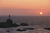 View of Corbiere Lighthouse at sunset, in the evening, Jersey, Channel Islands, Great Britain