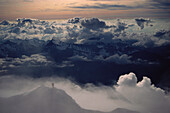 Alpinist on summit, Western Alps, The Alps, Europe
