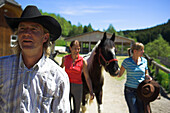 Horseriders walking from the stables, Muehlviertel, Upper Austria, Austria