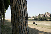 A couple sitting on the grass, Palatino, Circus Maximus, Rome, Italy