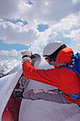 Snowboarder makes a turn, Kappl, Tyrol, Austria