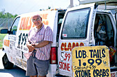 Street vendor with lobster tails and stone crabs, Miami, Florida, USA