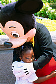 Mickey Mouse with child, Disneyworld, Orlando, Florida, USA