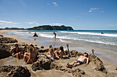 Relaxing in Thermal Pools, Hot Water Beach, Coromandel Peninsula, North Island, New Zealand