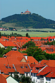 View over house roofs with Wachsenburg in the distance, Arnstadt, Thuringia, Germany