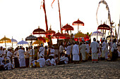 Locals at a Balinese Festival on the beach, Seminyak Beach, Bali, Indonesia