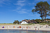 View over sandy beach with thatched house, Ahrenshoop, Fischland-Darß-Zingst, Mecklenburg-Western Pomerania, Germany