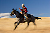 cowboy riding, Oregon, USA