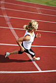 Woman runner on cinder track, , Carinthia, Austria