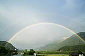 Rainbow over a street, Carinthia, Austria