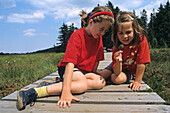 girls observing insects, boardwalk, high moor, Harz Mountains, Lower Saxony, northern Germany