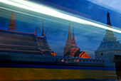 Evening traffic in front of Wat Phra Kaeo Temple, Bangkok, Thailand