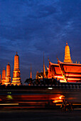 Evening traffic in front of Wat Phra Kaeo Temple, Bangkok, Thailand