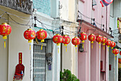 Chinese lampions hung up outside houses in the old town, Phuket Town, Thailand
