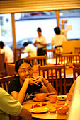 Family in restaurant, Ka Soh Restuarant, Chinatown, Singapore