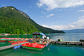 landing stage with red pedal boats, lake Walchensee, Upper Bavaria, Bavaria, Germany