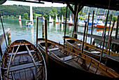 rowing boats in boat hut and lake Mattsee with sailing boats, Salzkammergut, Salzburg, Austria