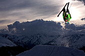 Skier jumping in the sunset, See, Tyrol, Austria
