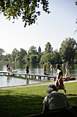 People bathing, Public beach on the north side of the lake, Wesslinger See, Upper Bavaria, Bavaria, Germany