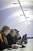 Students working on computers in the Uni Lounge, University, Ludwig Maximilians Universität, Munich, Bavaria, Germany