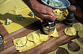 Man preparing pasta, restaurant La Campagnola, Salo, Lake Garda, Lombardy, Italy