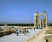 People at the ruins. Gate of Xerxes. Persepolis (Takht-e Jamshid). Fars. Iran