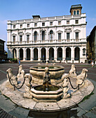 Biblioteca Civica Angelo Mai (library building) and Contarini fountain in Piazza Vecchia, Bergamo Alta (Upper Town), Bergamo. Lombardy, Italy