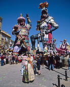 Fallera (woman in traditional dress) during the fallas festival, Valencia. Spain
