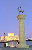 Column at port where it s supposed to have been the ancient Colossus. Rodhes. Greece