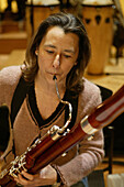 Concert. Woman playing bassoon