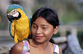 Guayo girl with macaw. Orinoco. Venezuela.