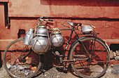Milk vessels on a bicycle in Puri Town, Orissa, India.