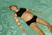 Pregnant woman swimming