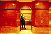 Lift attendant, elevator in a building. Manhattan. New York City. USA