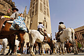 Romeros , pilgrims of Rocío procession starting from the cathedral. Sevilla. Andalusia. Spain.