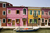 Laguna (lagoon) di Venezia. Burano. A canal with the typical colourful houses. Venice. Italy