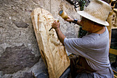 Dal Medioevo al Terzo Millennio Exhibition. The wood-carver Gianmario Monella at work. Sellero. Lombardia-Valcamonica. Italy.