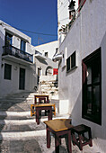 Street and tables. Mykonos. Greece