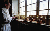 Monk and artcrafts. Bec-Hellouin Abbey. France