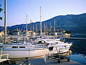 Boats at marina and the fortified town in background. Korcula Island. Croatia