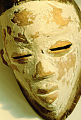 Punu ancient mask painted with kaolin for secret ceremonies. Gabon