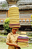 Hats seller in a temple. Bali island. Indonesia (model released)