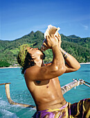 Polynesian playing formerly character in Tiki Village . Moorea island. Windward islands. French Polynesia