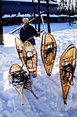 Snowshoes. Matawinie lake and resort in winter. Quebec. Canada