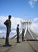 Statues in front of the cathedral designed by architect Oscar Niemeyer. Brasilia. Brazil
