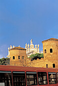 Detail of ramparts and Saint John Lateran basilica in background, bus at fore. Rome, Italy