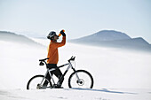 Mountain biker drinking from a bottle, Styria, Austria