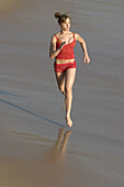 Woman running on beach