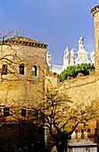 Detail of ramparts and Saint John Lateran basilica in background. Rome. Italy