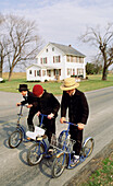 Amish boys on scooters. Pennsylvania, USA